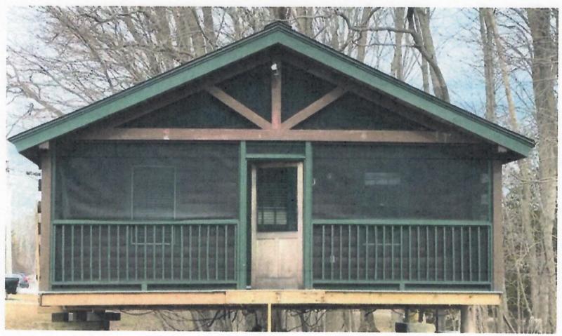 Rockport Center LLC, on the corner of Route 1 and Pascal Avenue, hopes the town will approve the idea of repurposing a former MNBA corporate retreat log cabin that used to be at Ducktrap Mountain in Northport, as an office/commercial building. “The building is a ‘top-of-the-line’ Maine-built log cabin,” said Douglas Clayton, owner of Rockport Center LLC. “Log cabins are part of Maine’s heritage and are sometimes used as professional buildings. For example, West Rockport’s post office is a log cabin and is often photographed as a ‘cute’ building.”
Clayton proposed, in his planning documents, that the cabin would be a positive addition to the gateway to Rockport Village.