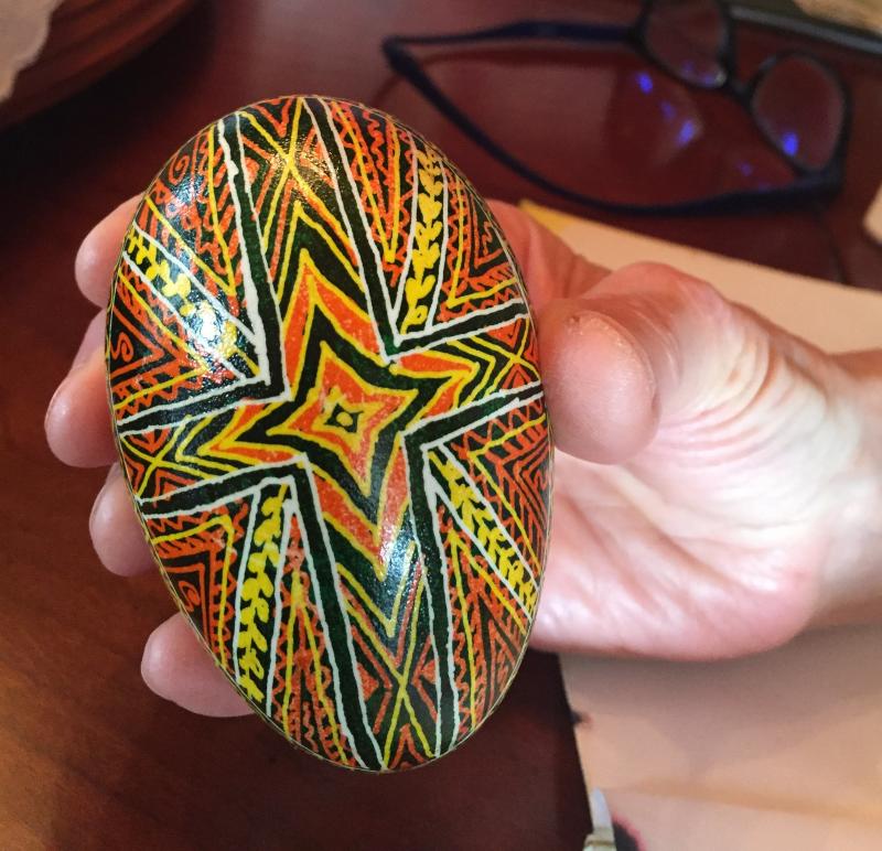 Alina Blakesley design using powerful colors : orange/endurance, black/eternity, darkest time before dawn; green/spring, hope, breaking bondage; and yellow/stars, moon, sun, perpetuation of family. LISA KRISTOFF/Boothbay Register