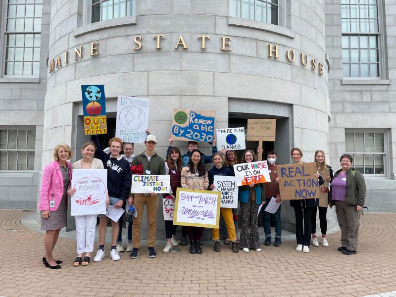 Representative Vicki Doudera, D- Camden, with Camden Hills Regional High School students during the Maine Youth Day of Action. From left to right: Doudera, Sadie Woodruff, Lincoln Pierce, Elsie Hildreth, Avery Hackett, Lizzie Larsen-Leavins, Ina Wolovitz, Quinn Riordan, Lea Zwecker, Allie Gill, Izzy Kinney, Hadrian Ward, Lucy OBrien, Amelia Porter, and Margo Murphy.