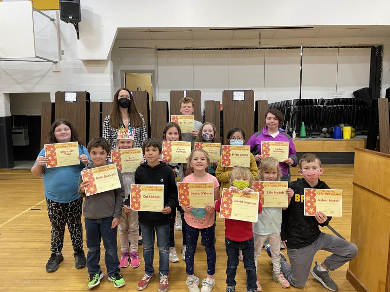 Principal Ainslee Riley presents the Positive Attitude Award to (front) Seth Beckett, Kai Liddell, Jayla O’Hare, David Grierson, Lily Hatch, Asher Hatch, (middle) Elizabeth Mank, Ella Chamberlin, Evelyn Fairfield, Kloe Maldonado, Erica Zheng, Karlee Melendez, and (back) Oliver Quinn.