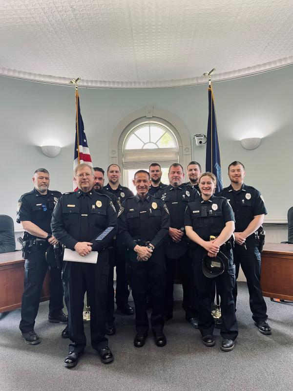 Pictured: Chief Robert Cormier, center, and members of the Belfast Police Department, including Deputy Chief Dean Jackson, Sergeant Matthew Cook, Sergeant Lewis Dyer, Sergeant Daniel Thompson, School Resource Officer Rick Smith, Officer Megan Tribuzio, Officer Jonathan Guba, Officer Jeremy Bell, and Officer Andrew Chapman. (Photo courtesy Belfast Communications Assistant Mackenzie Barnhart)