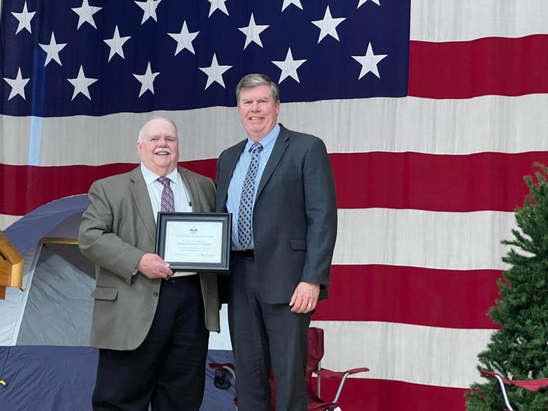 Roger Pomerleau presents the Distinguished Leadership Award to Chuck Hayes for all healthcare workers. (Photo courtesy Chuck Mahaleris)