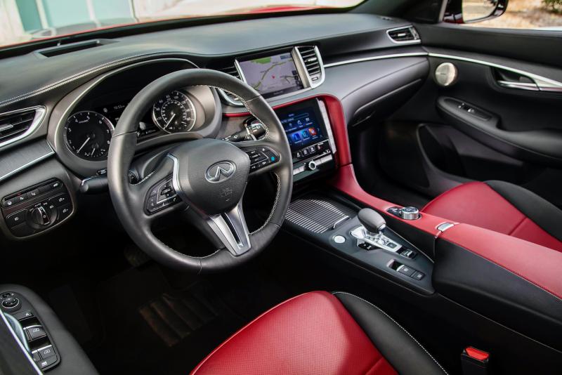 The QX55 has dual high-res touchscreens plus Apple CarPlay, Android Auto and four USB ports (one Type-C, three Type-A), but no inductive phone charger. The Sensory trim package includes Bose Performance Series audio with 16 speakers and the ProPILOT semi-autonomous driving system.