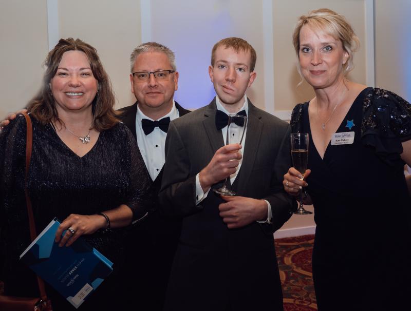 The Sheltons, a Wish Family, stand with Kate Vickery, CEO of Make-A-Wish. (Photo by Katie Kelley Photography)