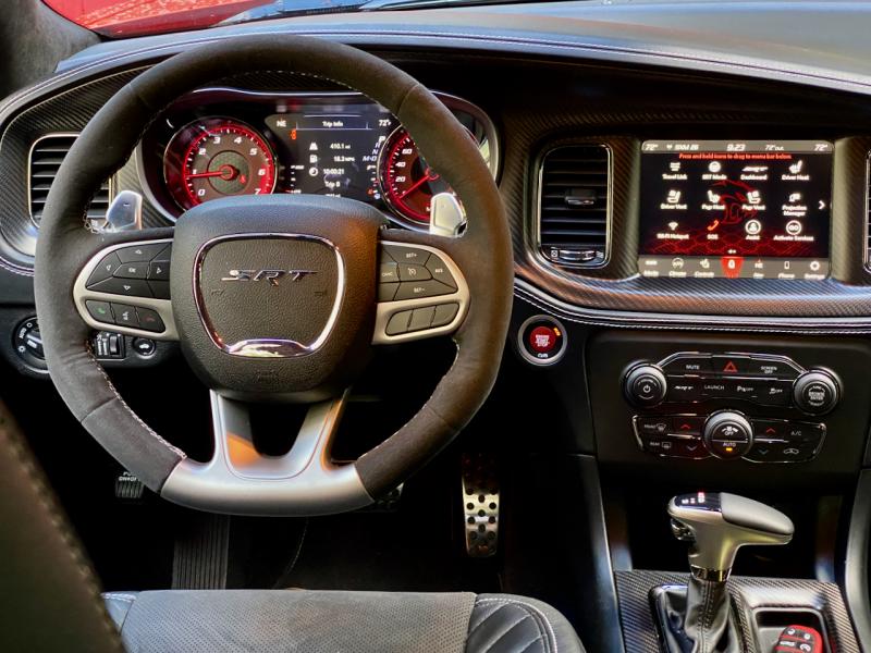It may not be pretty, but from the meaty steering wheel to the touchscreen with GPS, Apple CarPlay and Android Auto to actual knobs and buttons, the Charger SRT Hellcat cockpit means business.