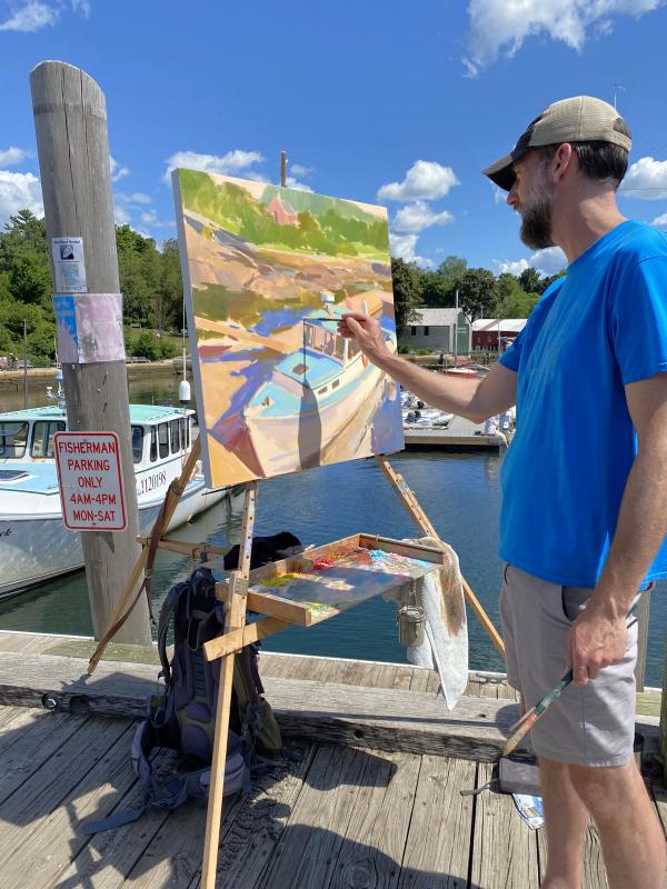 Artist Colin Page painted a lobster boat and the library "en plein-air" from the public landing in Camden during the Camden on Canvas Weekend. (Photo courtesy Camden Public Library)