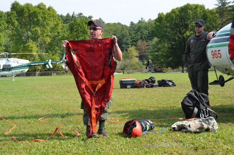The screamer suit is a a full-body harness that provides a closed safety cover for the patient during a short haul rescue. (Photo by Lynda Clancy)
