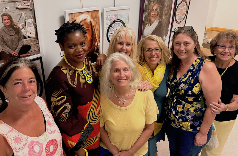 The Finding Our Voices exhibit at the University of Maine Hutchinson Center through October, with visiting survivors in the portraits left from right Mia from Lincolnville, Gloria, Liz, Janet, Patrisha, Betsy and Mary Lou. (Photo courtesy Finding Our Voices)