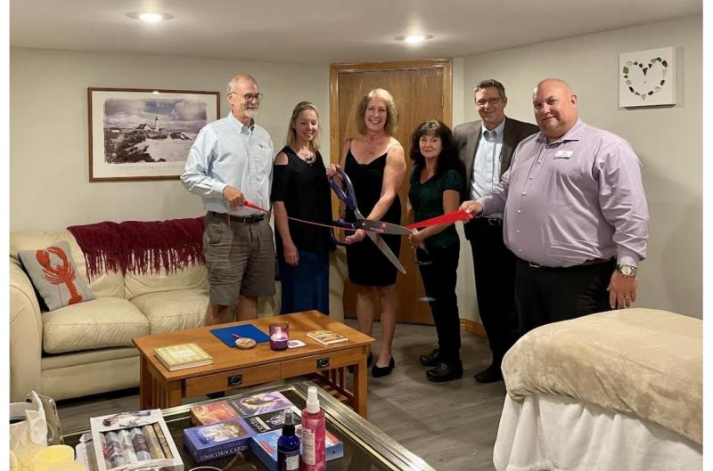 Rachel Glaser, owner and practitioner, (holding the scissors) along with (L to R) Sandy Cox, Julie Brooks, Janet Bouchard; Eric Belley and Chris Austin. (Photo courtesy Rachel Glaser)