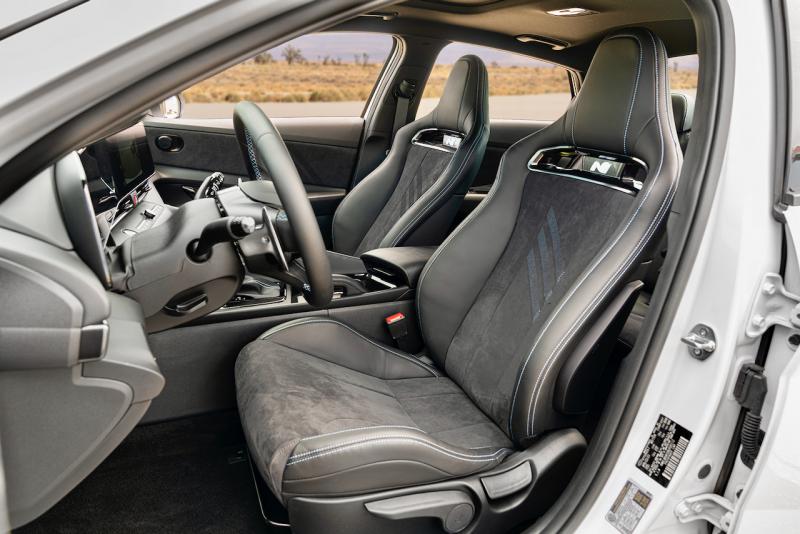 The Elantra N’s manually adjusted sport seats are comfortable and nicely dished for support in hard cornering; the slightly grippy upholstery helps keep us in place too. Those N badges below the headrests light up at night.