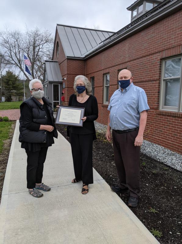 In 2021, Linda Greenlaw received a congratulations certificate for her years of service to Rockport. With her are former Select Board Chair Debra Hall and former Town Manager Bill Post.