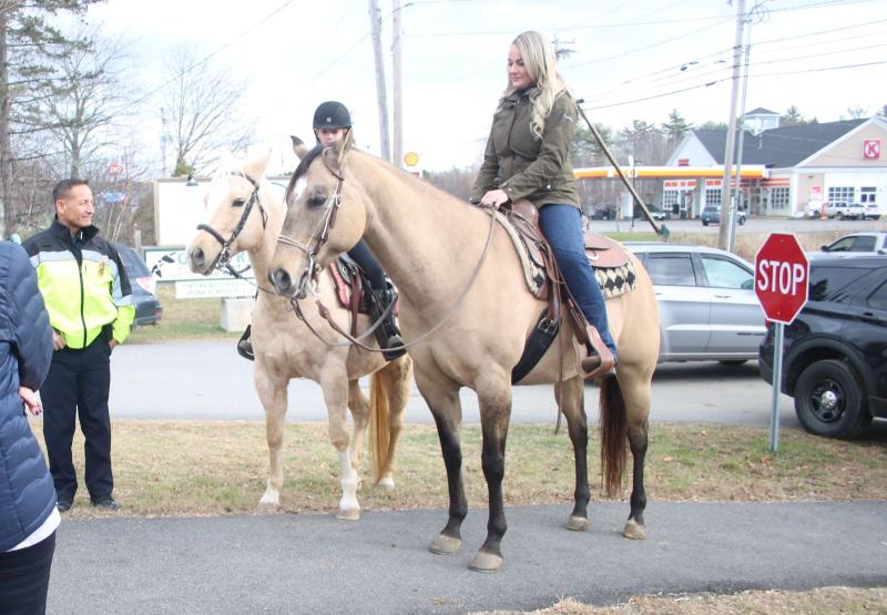 Belfast Police Chief Bobby Cormier stands left with two Horses Over America volunteers.
(photo by Erica Thoms)