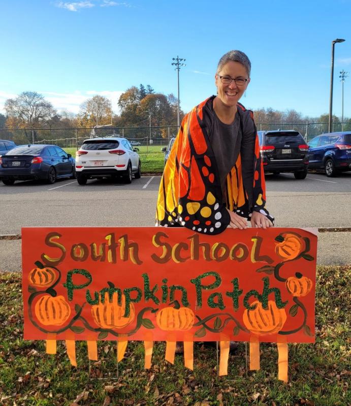 Mrs. Hamilton installing the sign for the pumpkin patch. (butterfly wings) (Photo courtesy South School)