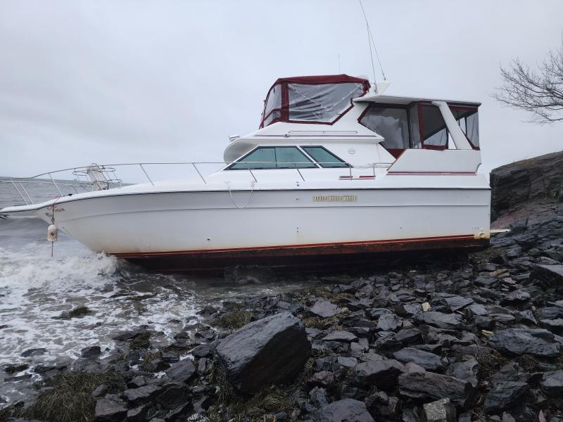 This boat washed up on an Owls Head beach during the Dec. 15 storm, the third or fourth boat in three years to break free of a mooring and get stranded on this particular beach. Boats, many fiberglass, get pummeled by harsh conditions, and if not salvaged quickly, they leave remnants on the beach and in the water. (Photo by William Garver)