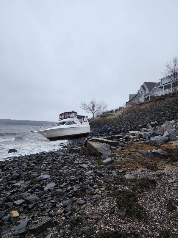 A pleasure craft is battered by the Dec. 15, 2022 storm in Owls Head. (Photo by William Garver)