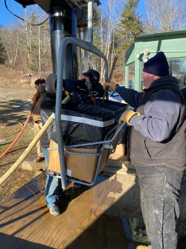 In order to make this real in terms of human weight on the chairlift, they place three boxes on each chair, 240 boxes total, and fill each with water. Each box holds approximately 50 pounds of water. (Photo courtesy Camden Snow Bowl)