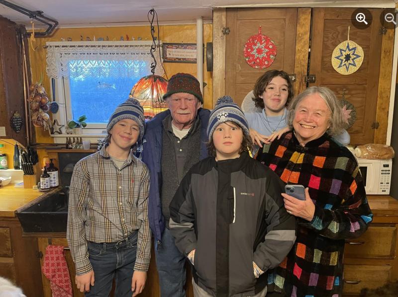 With two of the adults in the Upstairs Family down with Covid, Andy, Jack and Maggie, along with Don and I, headed off to the Christmas Eve service at church. We’re a far cry from my mother’s proper church garb: white gloves for the women and ties for the men. But hey, it’s Maine where jeans are always considered proper!
Photo by (a masked) Ed O’Brien off to church