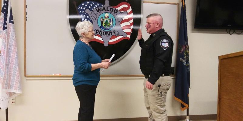 Blood swearing in Chief Deputy Curtis. (photo by Erica Thoms)