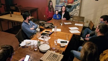 The Satellite club meeting at Flatbread featured guests Marissa Gildred, Ethan Gildred (center), and KCHC Development Director Becca Gildred