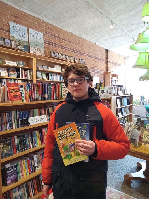 Ian Norwood redeems his contest gift card to buy his favorite series of graphic novels at Left Bank Books in Belfast. Photo by Kay Stephens
