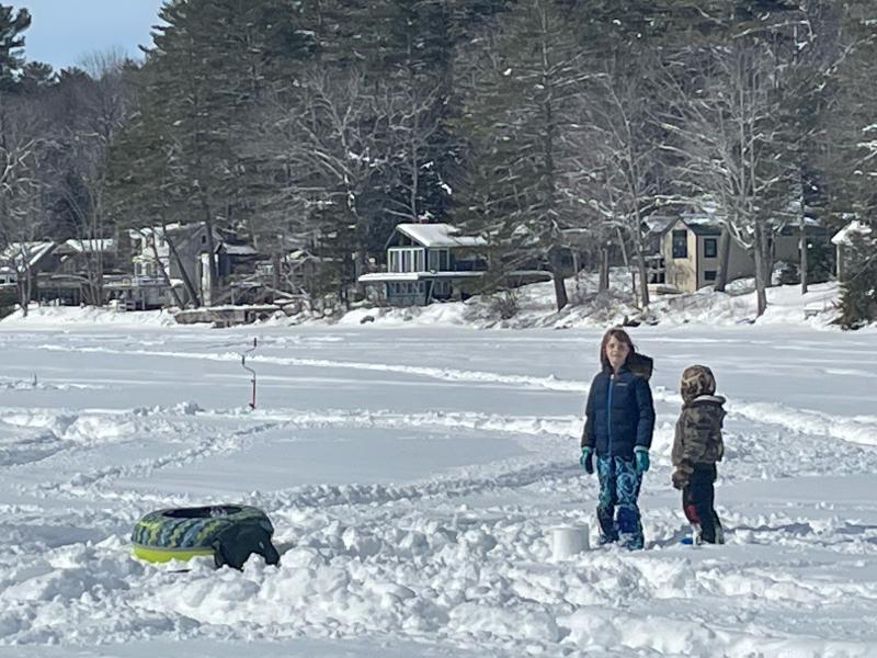 Emma and Sunny play in the snow near the traps. (Photo by Ed O’Brien) Kids