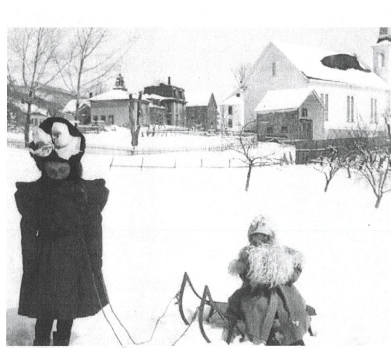 An old photo of the school house next to the grange. (Photo courtesy Long Funeral Home)