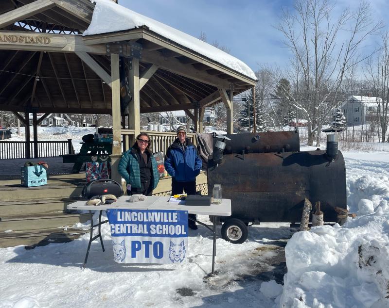 Jonathan Janaitis and Chelsea Mitchell of the Lincolnville PTO register the ice fishers for the derby (Photo by Ed O’Brien) LCS-PTO