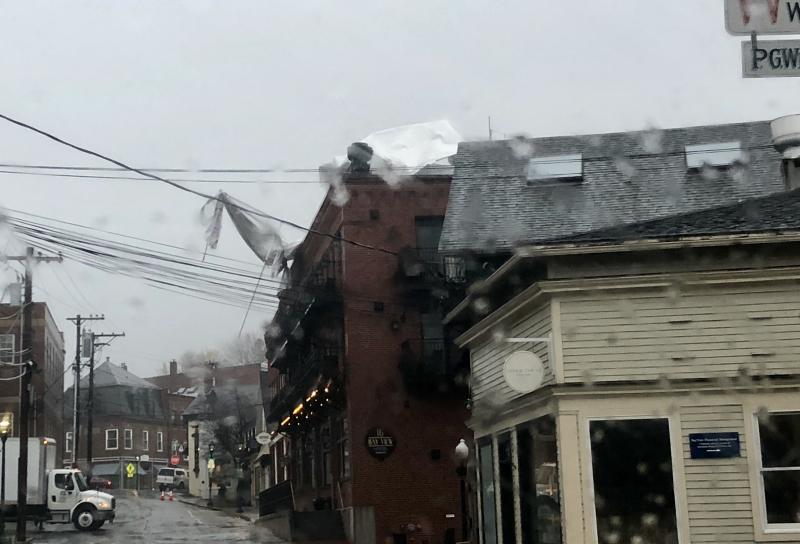 The rooftop awning at 16 Bay View hotel in Camden, on Bay View Street, was demolished from the gusting hard out of the east, and sent hanging over the building’s edge.
