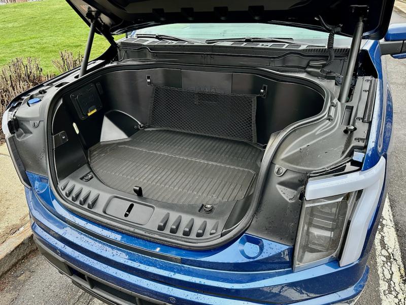 The famous frunk—the front trunk. With an electric motor on each axle, there’s now copious storage where the gas engine used to be. Ford has tuned the suspension to make the Lightning’s balance and weight distribution feel normal.