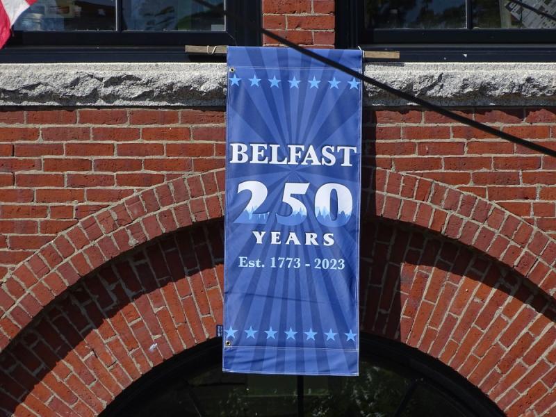 A banner hanging from the entrance of Belfast City Hall commemorates the event. (photo by Erica Thoms)