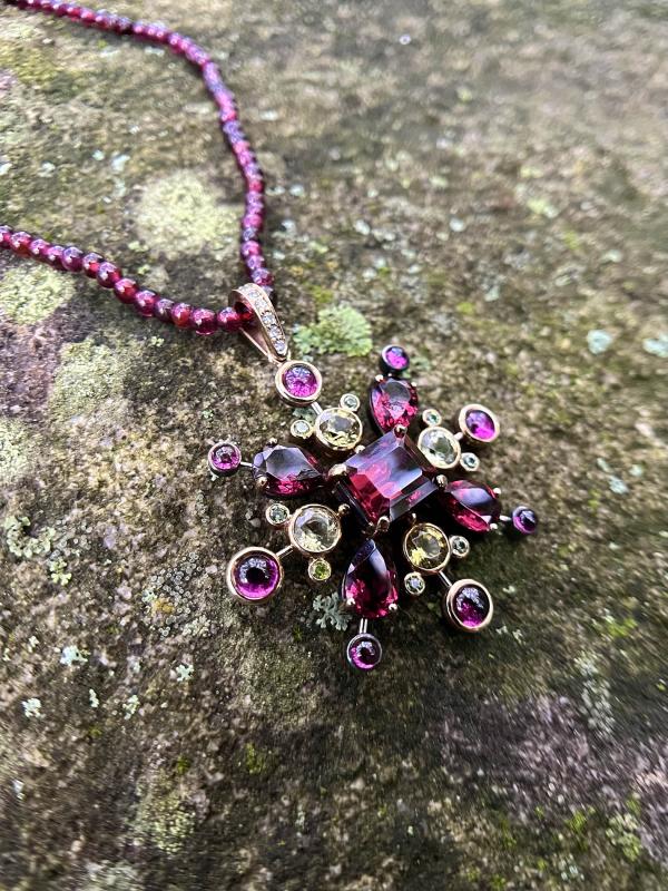 Garnet Burst Necklace harvests the light. Photo courtesy Seth Fainkujen