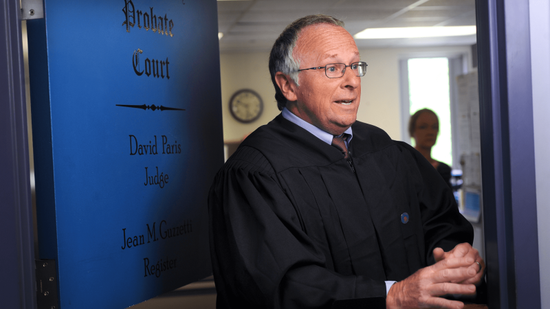 Judge David Paris runs the Sagadahoc County Probate Court without a permanent courtroom. Paris wasn't even provided a robe, his wife ordered him a set online. He holds hearings in the county commissioners’ room, grand jury room or even the lunchroom. Still, he says, he runs his court like any other judge and as professionally as he can. Photo by Fred J. Field.
