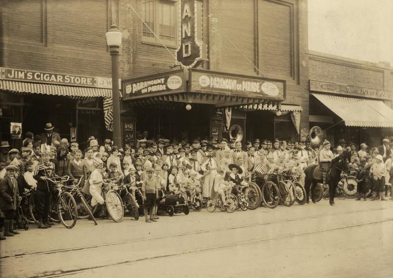 Strand Theatre archive photo. Rockland kids assembled on May 28, 1930, for a parade to celebrate the screening at the Strand of "Paramount on Parade, an “all-talking, all-singing musical revue” featuring that studio's entire roster of stars in songs and sketches, with several scenes shot in Technicolor. This spectacular film inspired many such ballyhoo stunts around the country. The small boy with glasses at front center-left, just in front of the lamppost, is ten-year-old Meredith Dondis, son of theater owners Joseph and Ida Dondis, who would one day preside over the Strand himself.