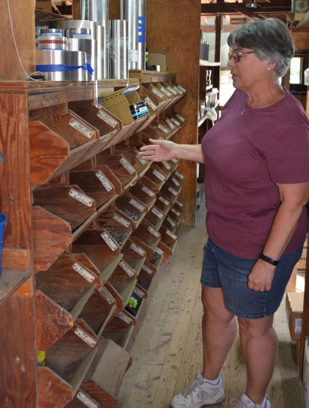 Lisa Burgess, beside the nail station at Rankin’s Hardware and Supply. (Photo by Lynda Clancy)