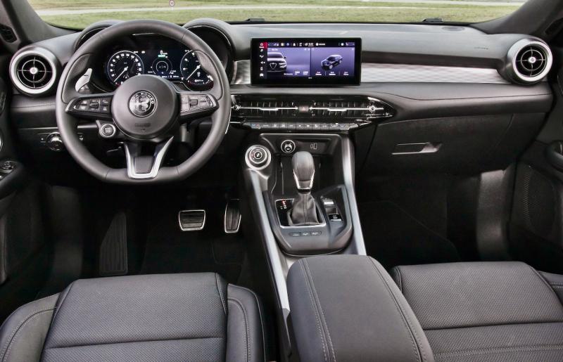 Alfa Romeo goes its own way with switches and controls—note the starter button on the left side of the steering wheel—but everything is driver-focused and easy to use.