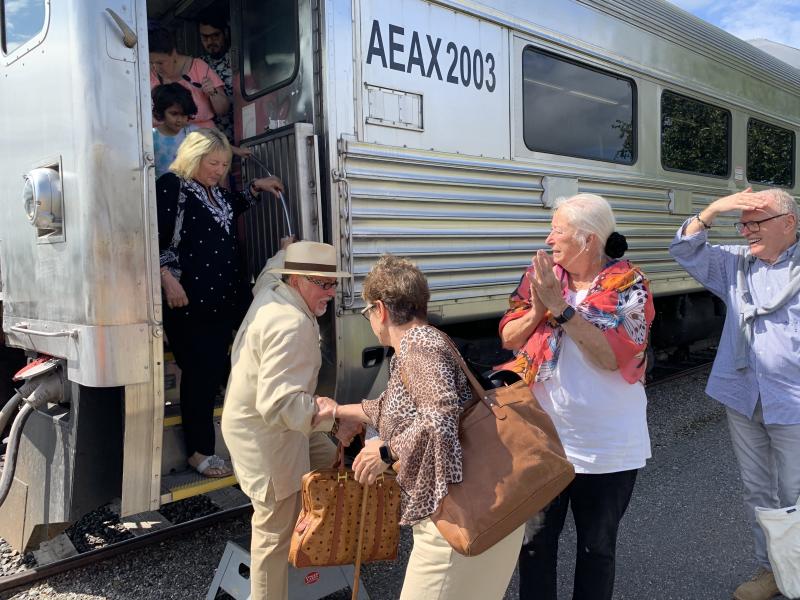 Wiscasset Selectman Terry Heller, second from right, applauds as fellow passengers disembark in Bath Aug. 26 after taking the Coastliner’s first Wiscasset-Bath excursion run. SUSAN JOHNS/Wiscasset Newspaper