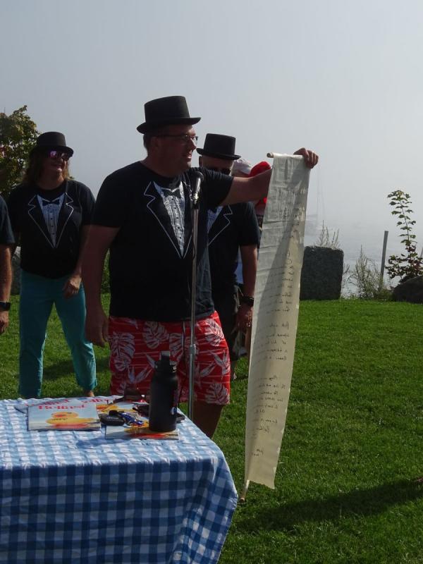 Baron Dave Crabiel reads Passy Pete’s 2023 message to the crowd.