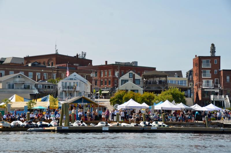 The Public Landing at Camden Harbor is festive as a crowd gathers to hear Capt. Jim Sharp tell tales and impart maritime history. (Photo by Lynda Clancy)