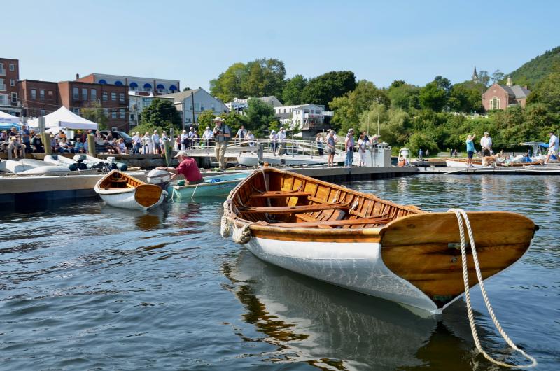 Richard Stetson gets the elegant wooden skiffs over to the dock. (Photo by Lynda Clancy)