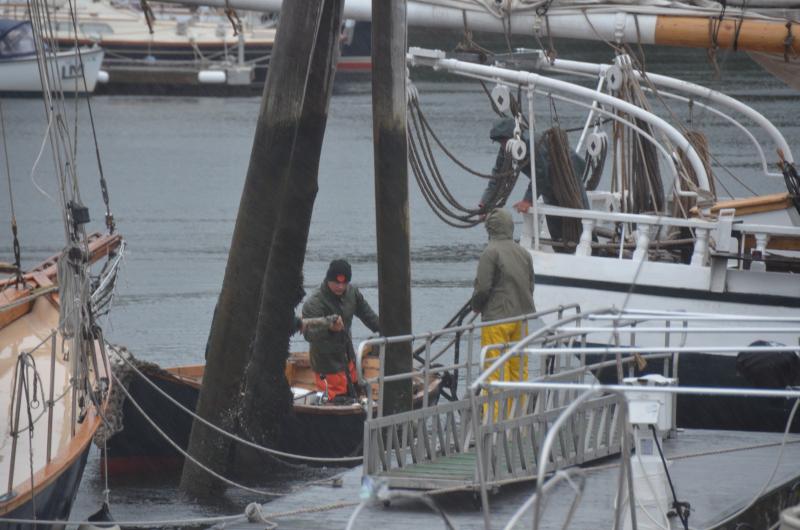At Camden Harbor, 7 a.m., a crew was working fast to re-secure the Mercantile schooner.