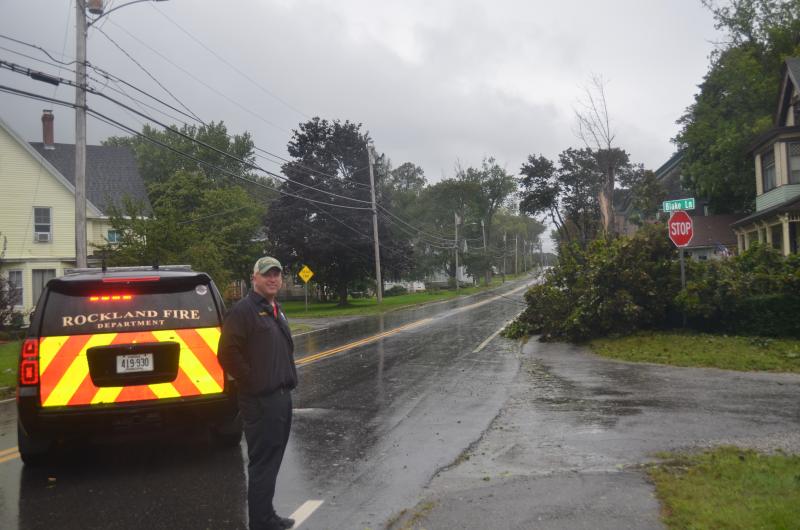 In Rockland, Fire Chief Chris Whytock plans to block traffic along a section of Broadway where a large tree fell on power Iines Saturday morning, Sept. 16. (Photo by Lynda Clancy)