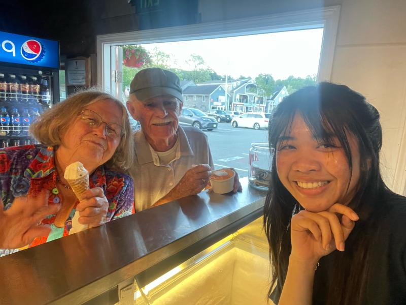 Diane O’Brien and Don French enjoy an ice cream at the Lobster Pond, served by Tia, of Bangkok, Thailand. (Photo courtesy of Diane O’Brien)