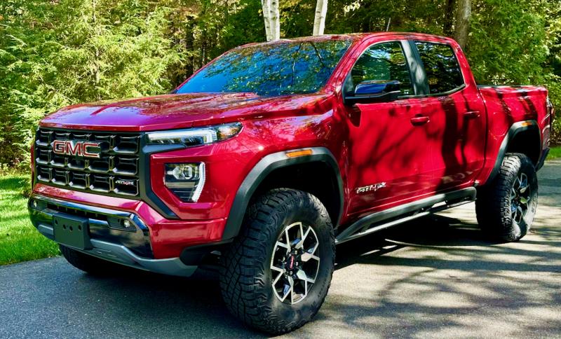 The AT4X package elevates (literally) the midsize Canyon pickup to the thin ranks of vehicles equally competent on pavement and off—if you can climb up into it. This color is Volcanic Red Tintcoat over an Obsidian Rush interior.