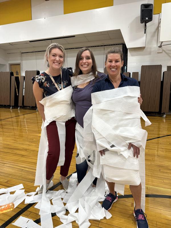 Teachers Crystal Baughman, Anna Cosgrove, and Lynn Snow wrapped as mummies. (Photo courtesy Thomaston Grammar School)