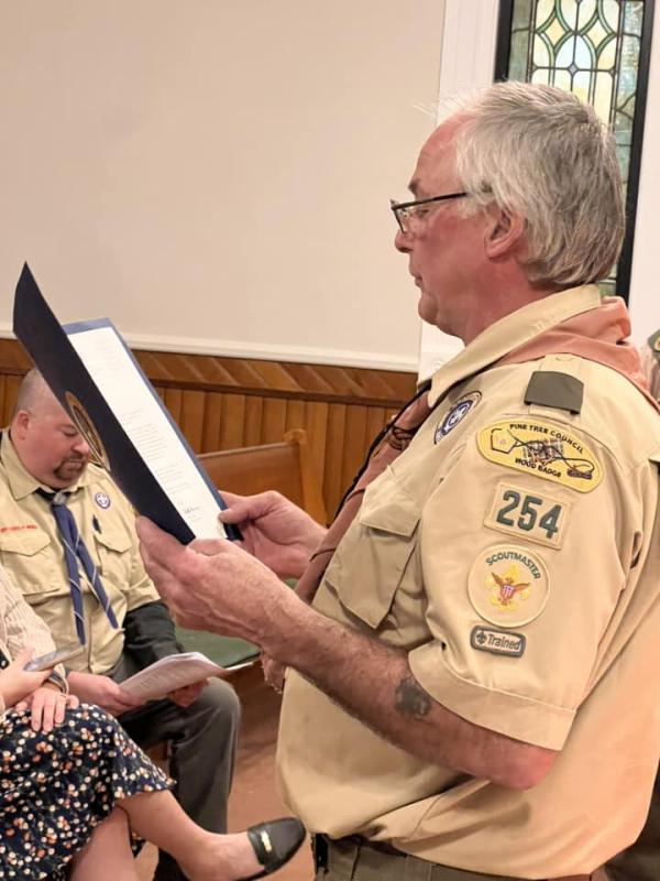 Scoutmaster Bruce Bossow read a congratulatory letter for U.S. Representative Chellie Pingree. (Photo courtesy Chuck Mahaleris)