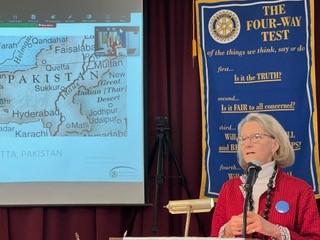 Elizabeth McClellan, founder of Partners For World Health, speaks at the weekly meeting of West Bay Rotary in Camden.