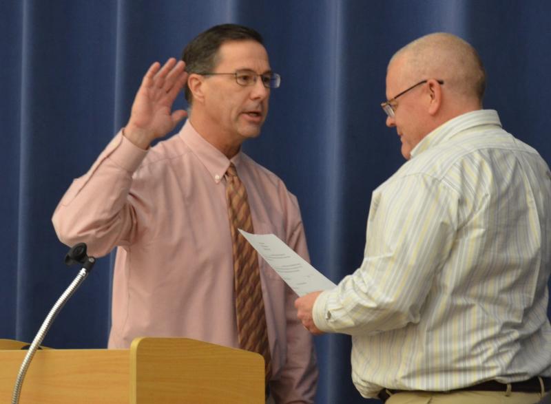 Lincolnville Town Administrator David Kinney (right) swears in Moderator Andrew Hart, of Camden (and Knox County Administrator), who would oversee the Dec. 11 special town meeting. (Photo by Lynda Clancy)