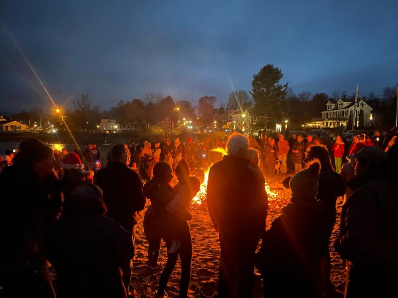 Carols around the fire. (Photo by Ed O’Brien