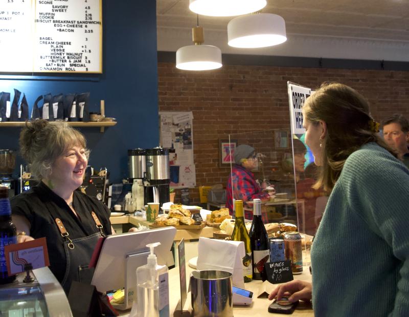 Perch Cafe owner Lynn Bachelder serves patrons don Dec. 2. (Sarah Masters photo)