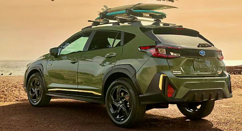 For 2024, the Crosstrek has been redesigned. The Sport model sits 8.7 inches high on 18-inch alloy wheels with all-terrain tires. Alpine Green is one of the hot colors this year, and the Sport trim gets yellow and black accents and special badges. The roof rack is an available option.